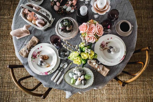 Round dinner table decorated with Easter motifs