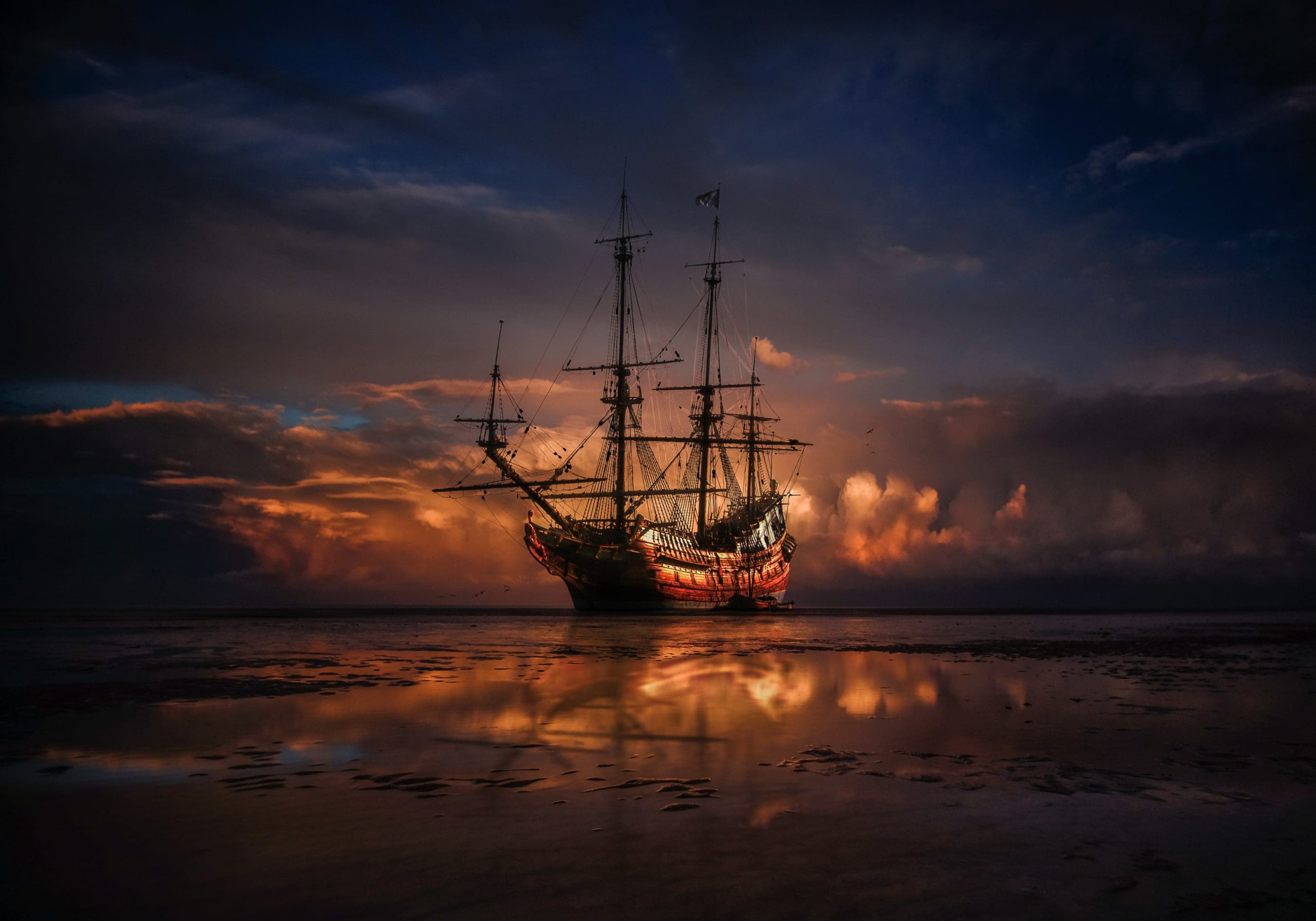 Pirate Ship sailing off in in Sunset with your videos